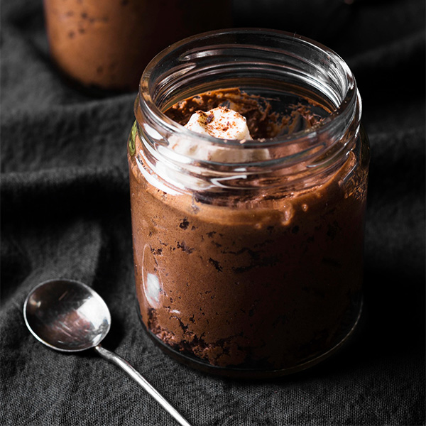 Toffee Pudding with vanilla custard served in a glass jar